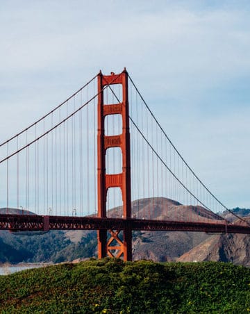 golden gate bridge in san francisco, california with hills in the background