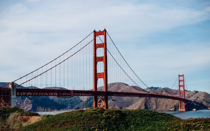 golden gate bridge in san francisco, california with hills in the background