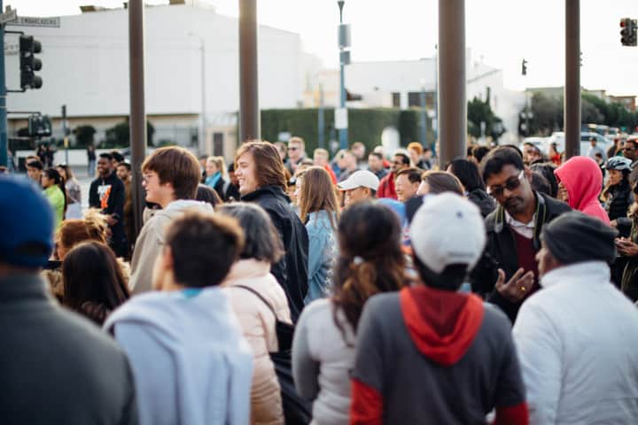crowd of people gathered on embarcadero street in san francisco california