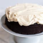 guinness beer dark chocolate cake on a white cake stand