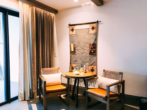 table and chairs with tapestry on wall riviera maya mexico unico 2087