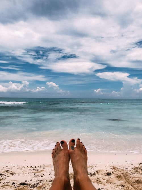 toes with beach and caribbean ocean in background riviera maya mexico unico 2087