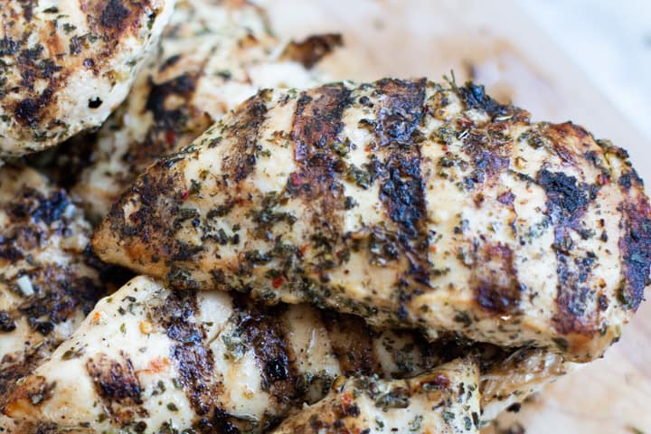 cilantro lime green chile grilled chicken on a cutting board