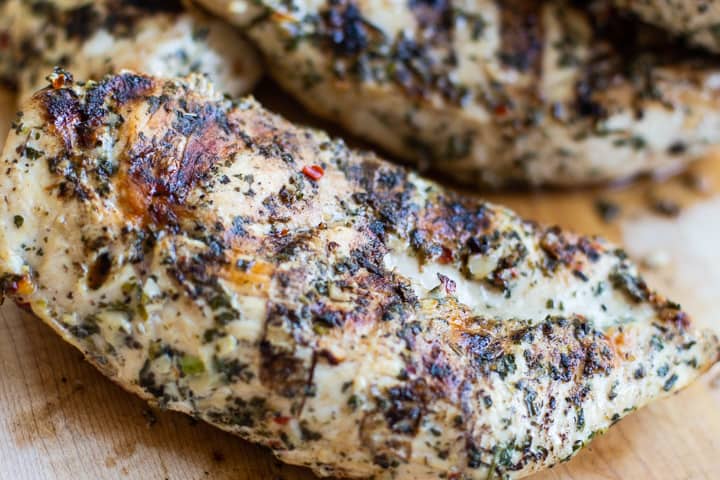 cilantro lime green chile grilled chicken on a cutting board