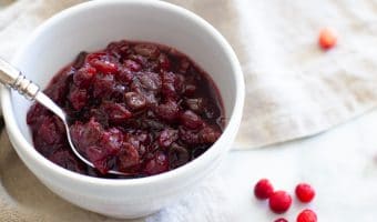 Fresh Cranberry Sauce is so simple to make and is a great make ahead dish that can simplify your hectic holiday cooking. In addition to fresh cranberries, this recipe uses dried tart cherries for added flavor and dimension. Forget about the canned stuff, this homemade Fresh Cranberry Sauce is so easy, so simple and so good! This recipe has graced my Thanksgiving table for the past 20 years and I hope it becomes a family favorite of yours too!