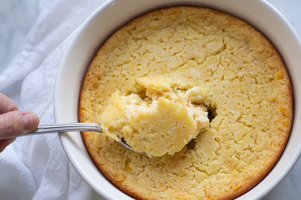 This creamy Corn Casserole is the perfect side dish to accompany your favorite holiday meals. Made with creamed corn, sour cream, and sweet cornbread mix, this recipe is sure to please and is a breeze to make! Only 7 ingredients!
