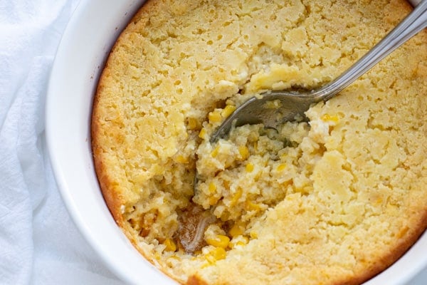 This creamy Corn Casserole is the perfect side dish to accompany your favorite holiday meals. Made with creamed corn, sour cream, and sweet cornbread mix, this recipe is sure to please and is a breeze to make! Only 7 ingredients!