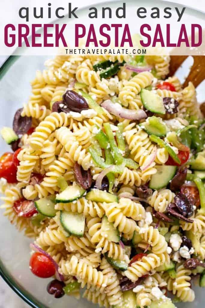 bowl of greek pasta salad with text overlay