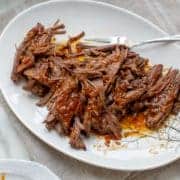 instant pot brisket shredded on a plate