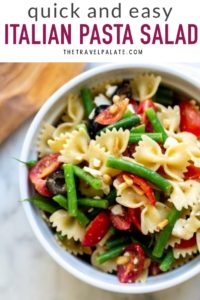 Italian pasta salad in a bowl with text overlay