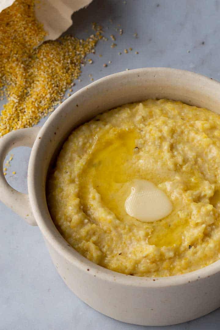 grits in a bowl with melted butter