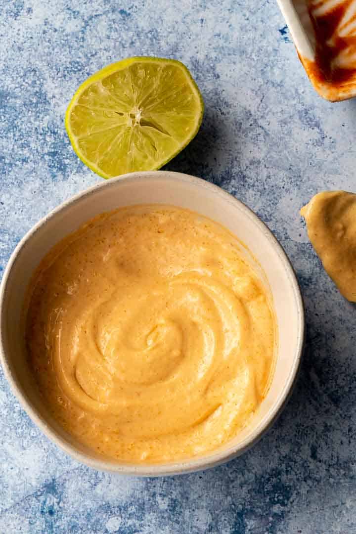 Sriracha Mayo in a bowl with lime in background