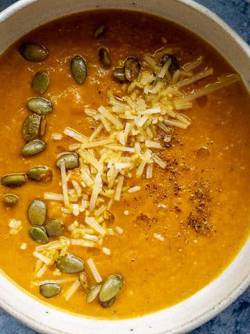 close up of a bowl of pumpkin apple soup