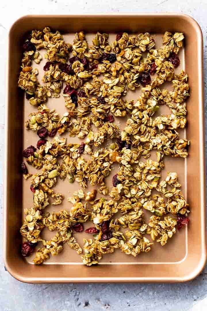 homemade granola recipe cooling on a cookie sheet