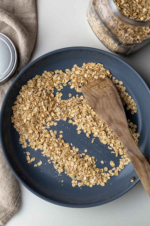 toasting rolled oats in a skillet