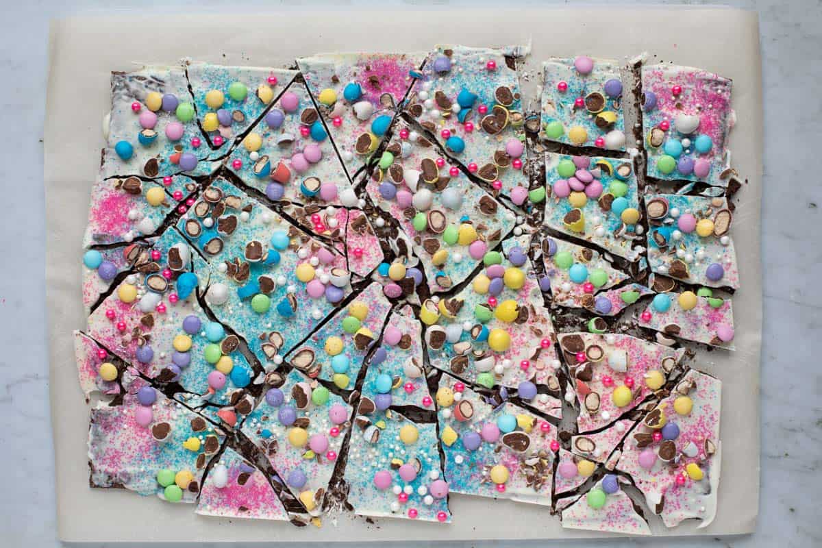 easter bark broken into several pieces on a parchment paper