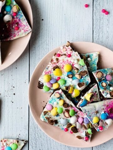 easter candy bark broken into pieced on a pink plate