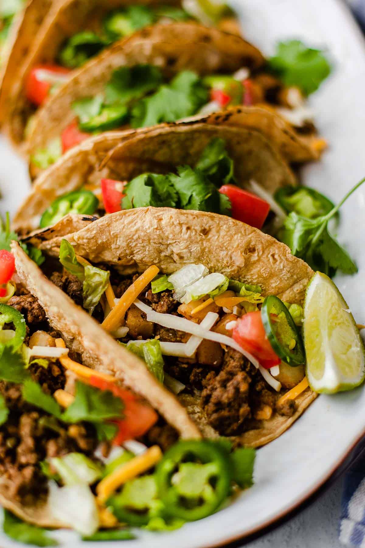 close up of tacos on a platter