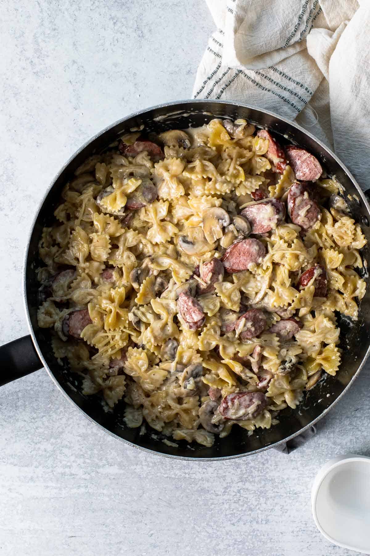 creamy sausage pasta recipe in a skillet