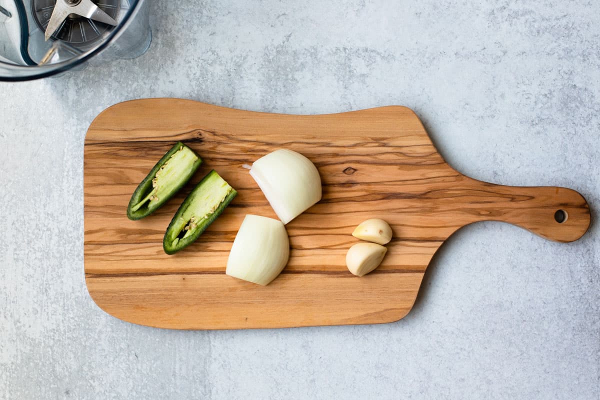 jalepeno, onion and garlic on a cutting board