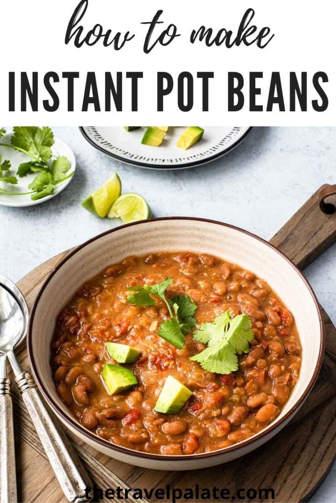 bowl of mexican beans with cilantro leaves and diced avocado