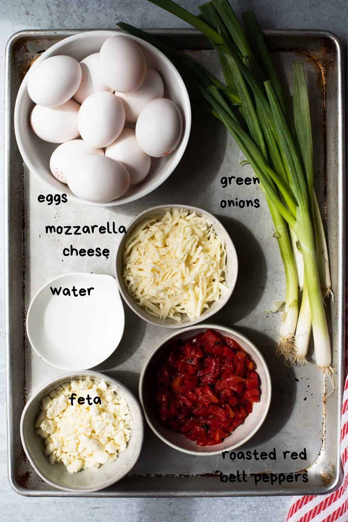 ingredients on a baking sheet with text labels