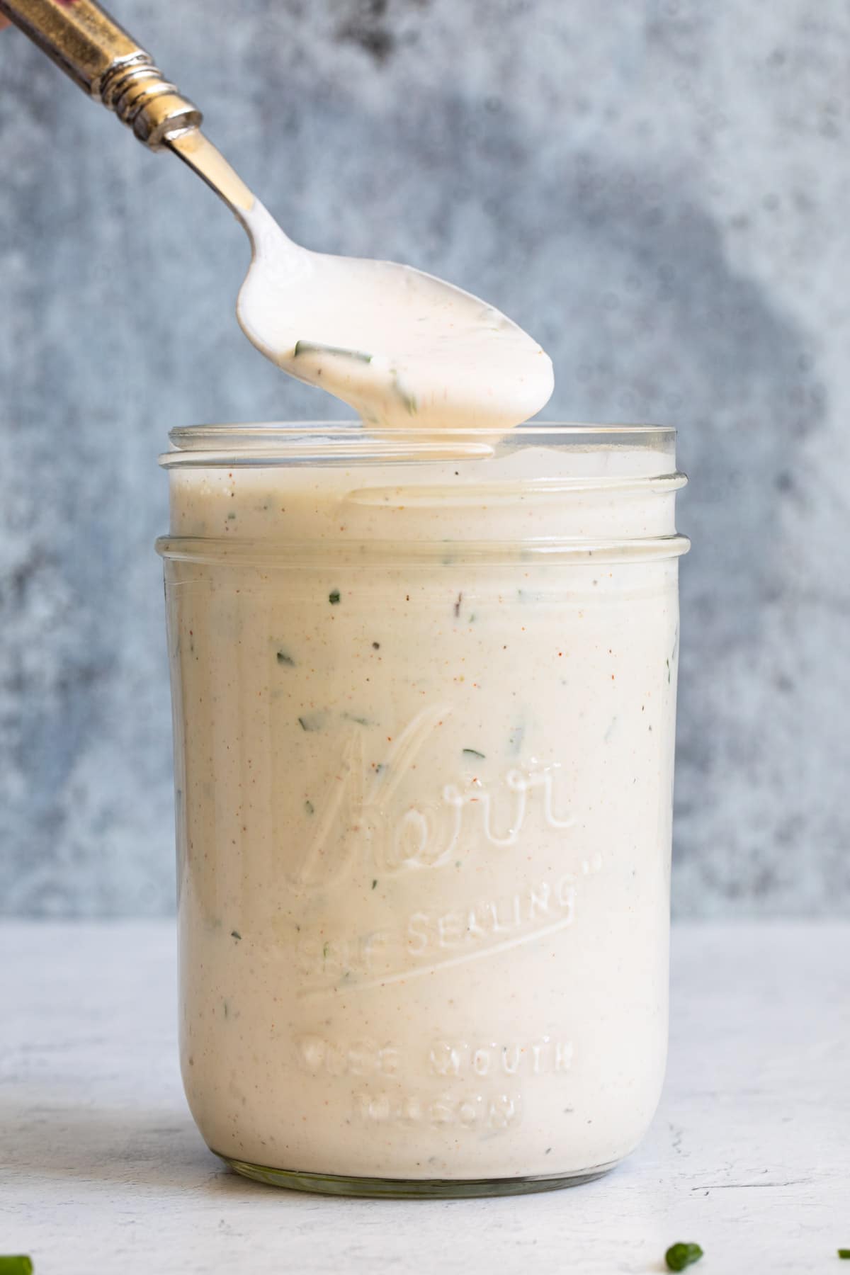 ranch dressing in a mason jar with a spoon