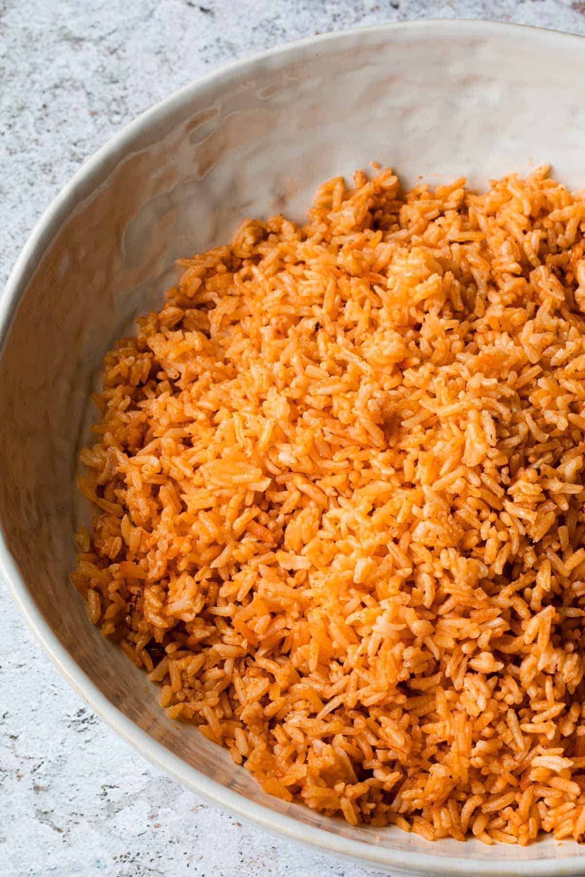 close up of mexican rice in a white bowl