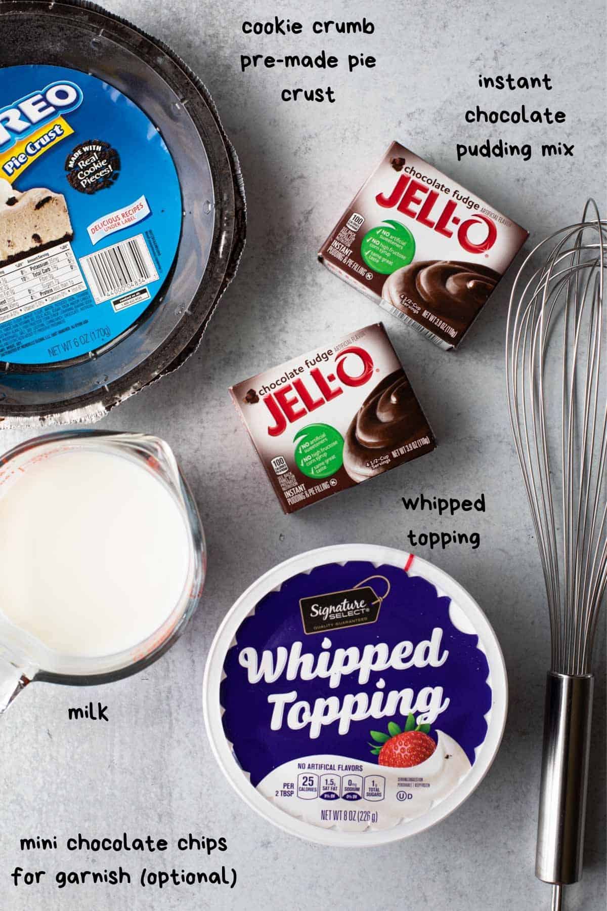 overhead view of recipe ingredients-whipped topping, pudding mix, milk, crust