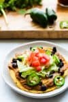 tostada with cutting board in background