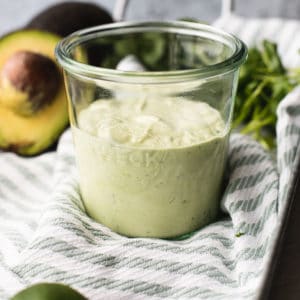 close up view of dressing in a glass jar