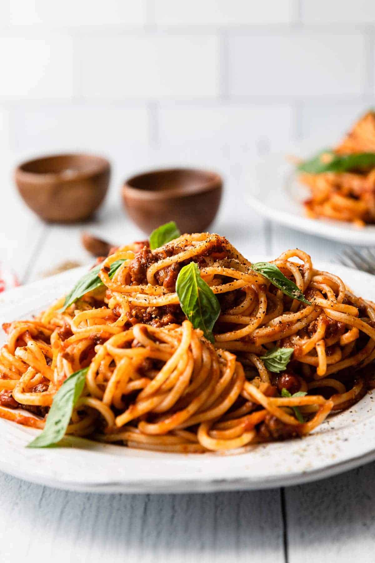 straight on angle close up of spaghetti piled on plate