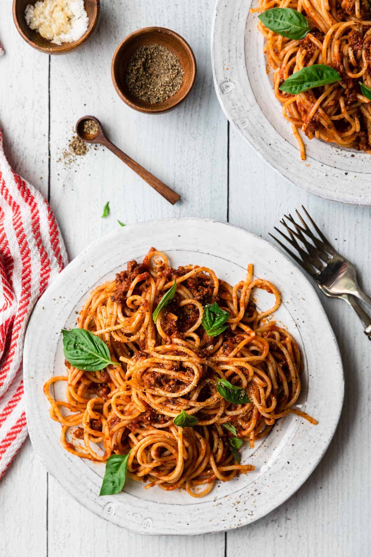 overhead view of a white plate with a helping of spaghetti