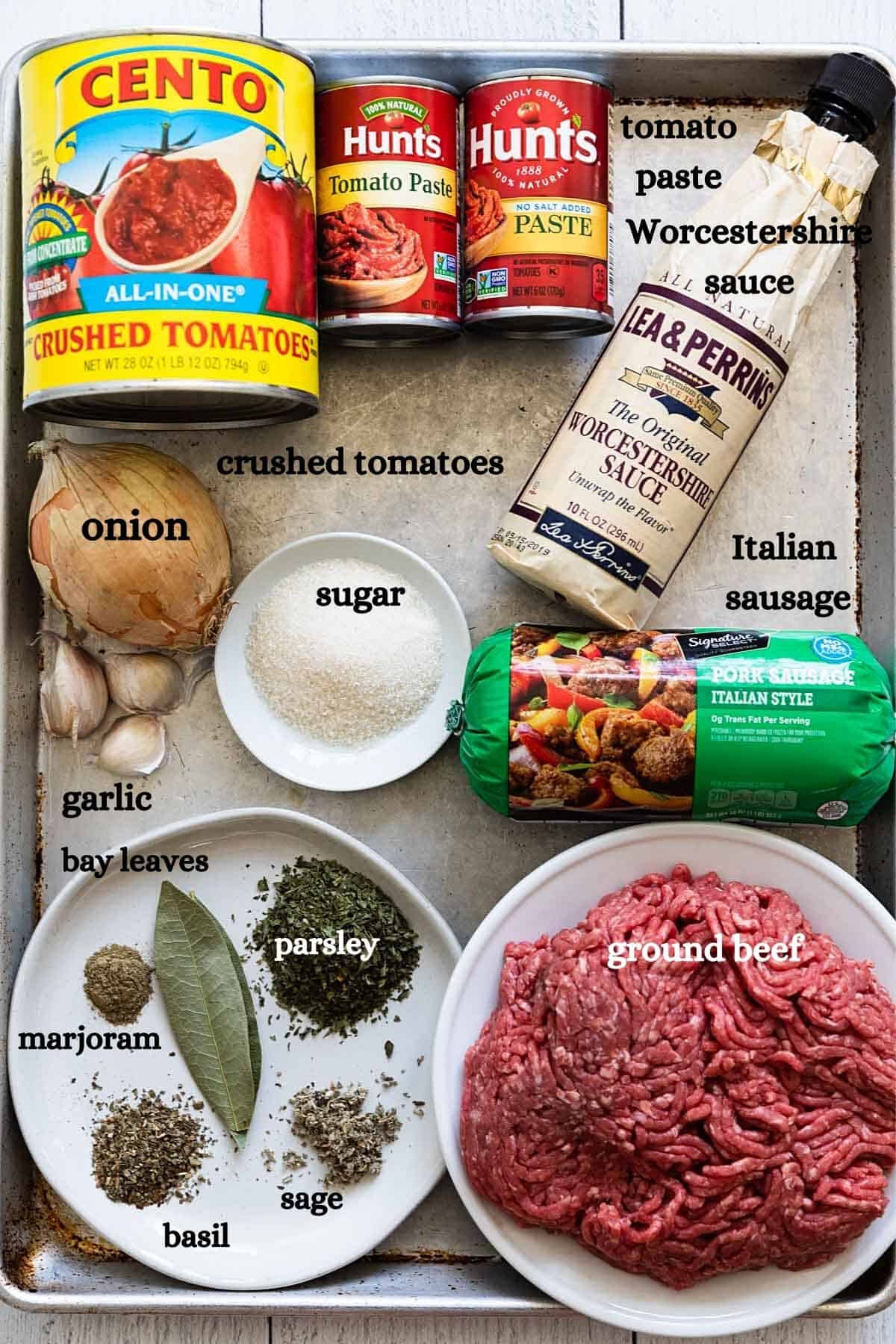 overhead view of meat sauce ingredients on a baking sheet