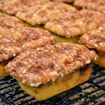 several mini loaves of apple bread on a cooling rack