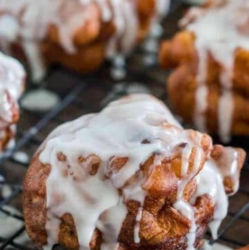 close up view of apple fritter covered in icing