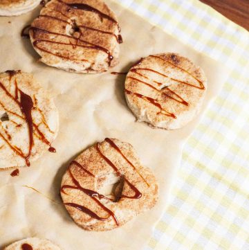 apple doughnuts drizzled with a dark syrup