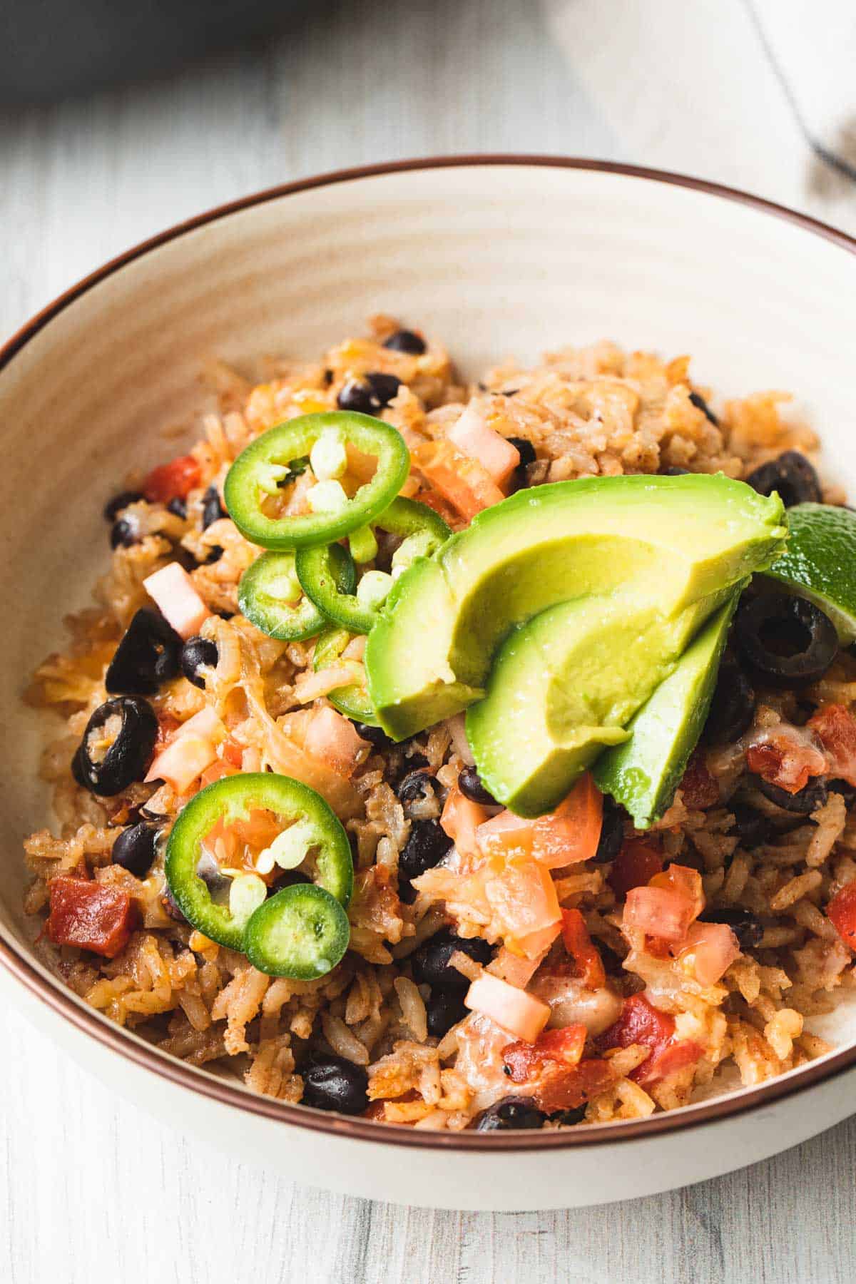chicken burrito bowl recipe in a bowl with toppings