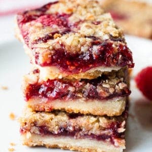 close up view of a stack of raspberry bars