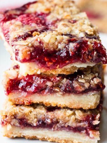 close up view of a stack of raspberry bars