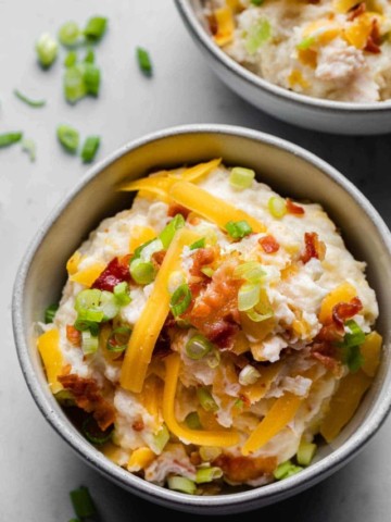loaded mashed potatoes in a bowl close up