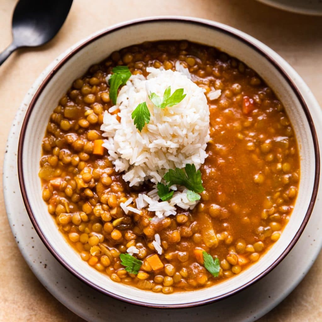 curry lentil soup topped with rice