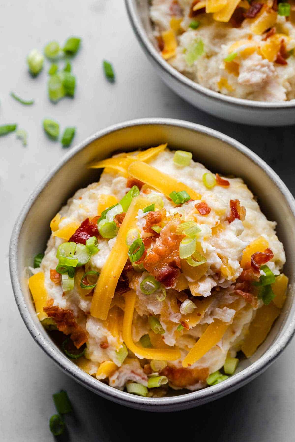 loaded mashed potatoes in a bowl close up