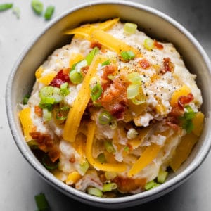 loaded mashed potatoes in a bowl close up