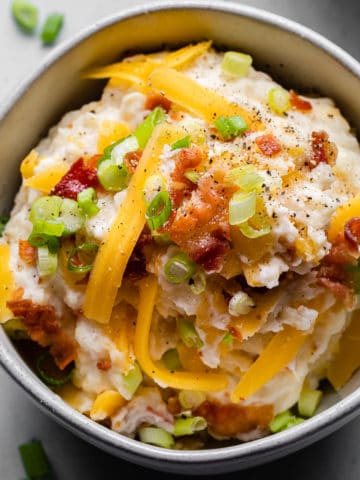 loaded mashed potatoes in a bowl close up