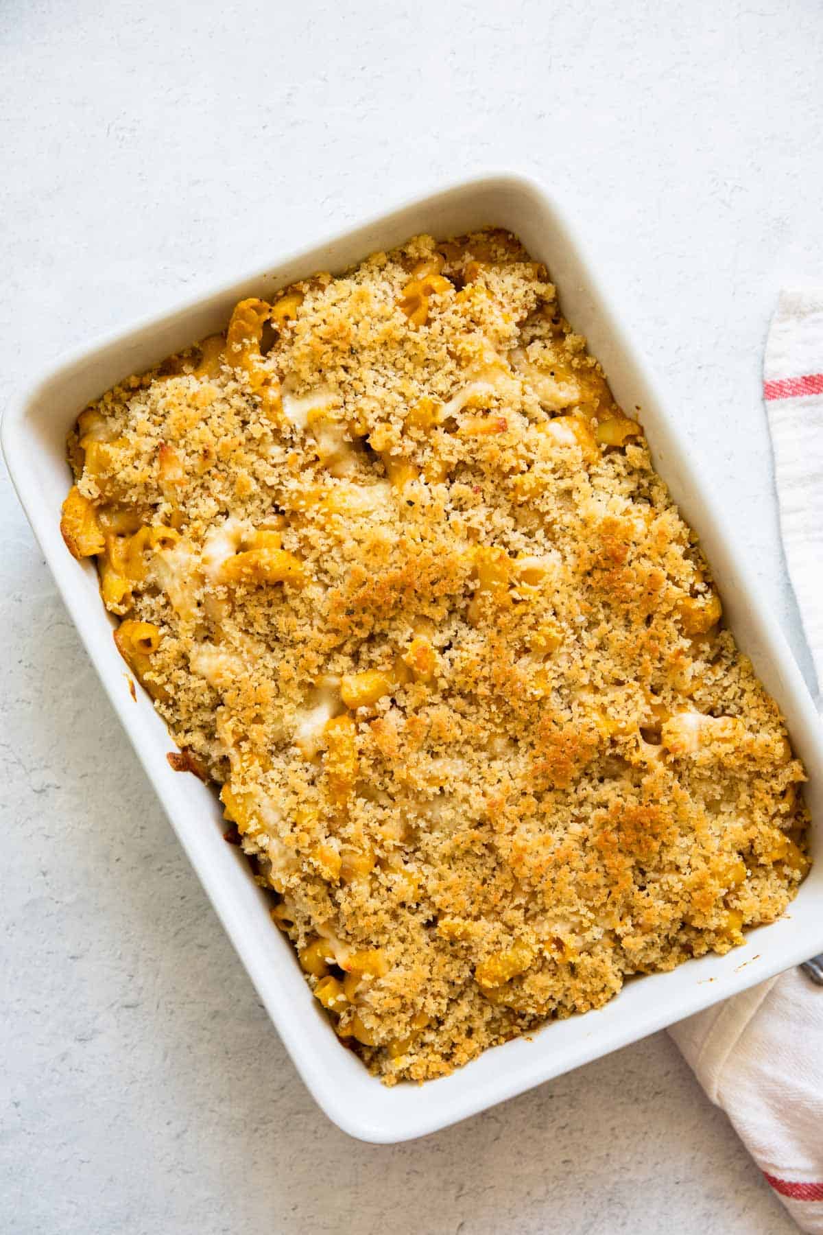 pumpkin mac and cheese baked in a casserole dish