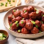 A bowl of cranberry meatballs.