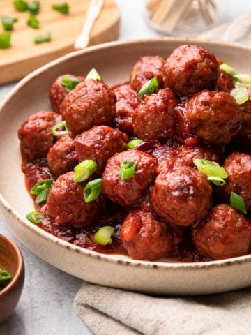 A bowl of cranberry meatballs.