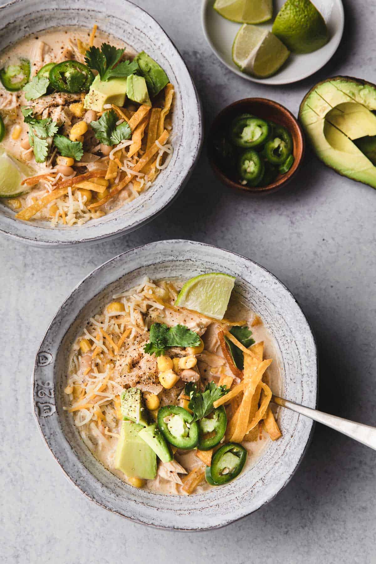 bowl of chicken chili with toppings