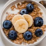 Steel cut oats with bananas and fresh blueberries.